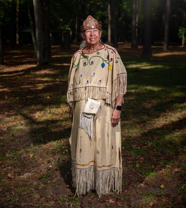 Chief Lynette Allston in traditional buckskin dress and crown