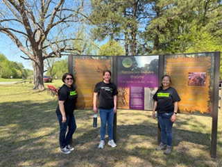 Three volunteers standing by the Nottoway Indian history signs