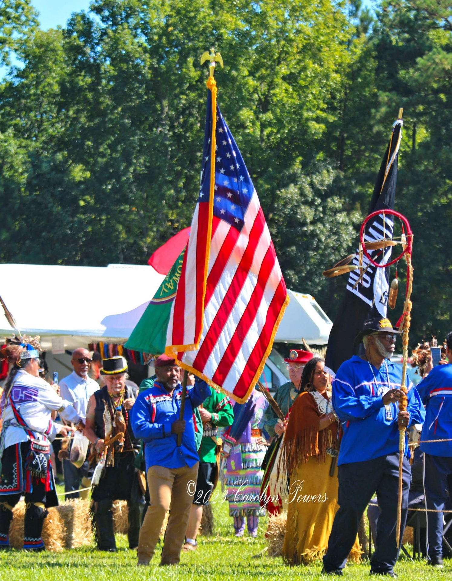 Color guard carrying the American flag and Nottoway tribal flag