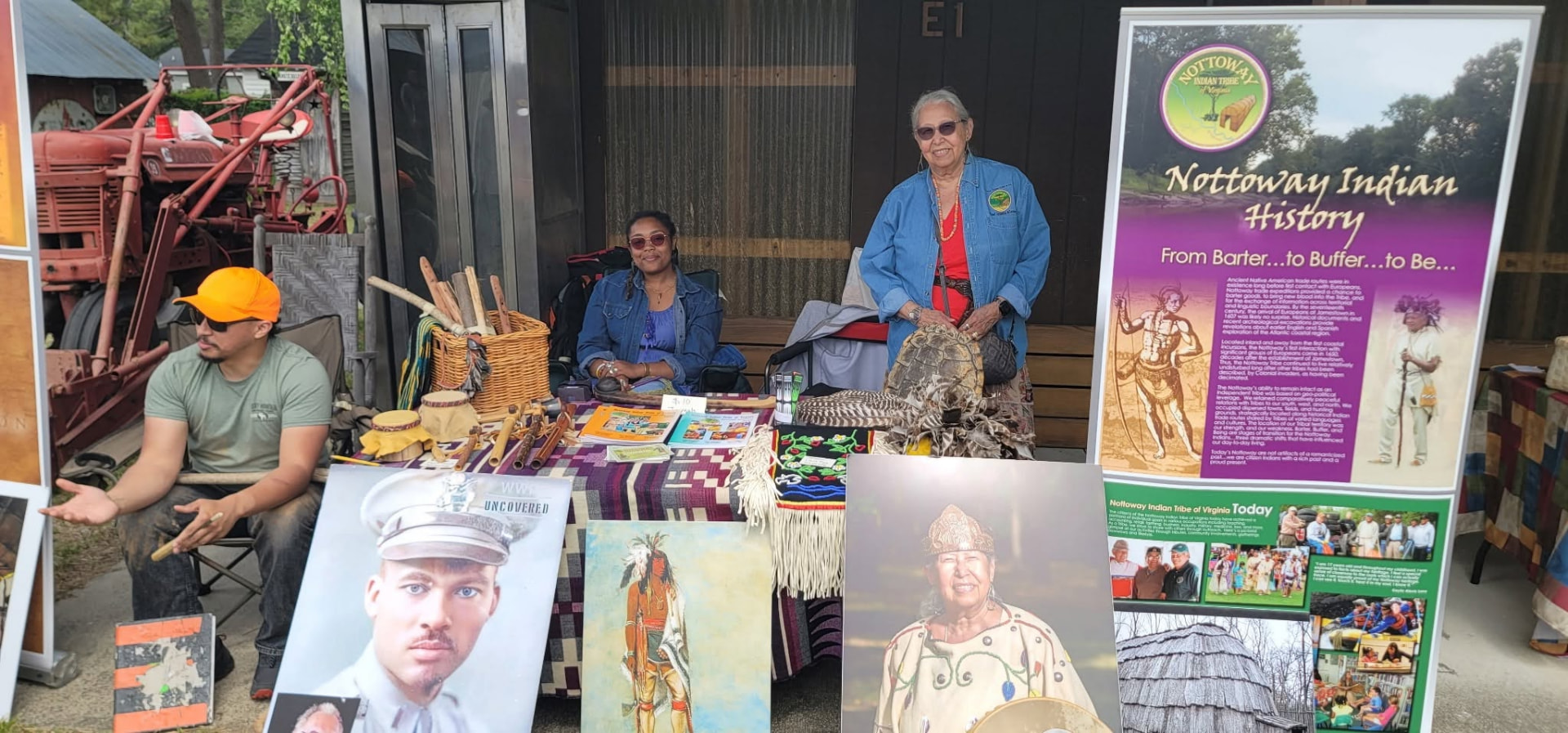 The Nottoway Indian Tribe booth at the Southampton Heritage Festival, with a Nottoway Indian History banner and display posters beside the table